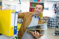 man buying stack ringbinders Royalty Free Stock Photo