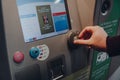 Man buying a ticket from a machine at metro station in Brussels, Belgium Royalty Free Stock Photo