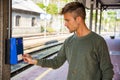 Man buying ticket on station Royalty Free Stock Photo