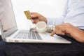 Man buys music on-line on computer with credit card, e-commerce Royalty Free Stock Photo