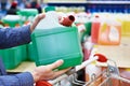 Man buys windshield washer fluid in shop Royalty Free Stock Photo