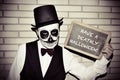 Man with calaveras makeup, with chalkboard with text have a deat Royalty Free Stock Photo