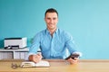 Man calculates tax at desk in office Royalty Free Stock Photo