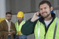 Man On Call With Colleagues In Factory Royalty Free Stock Photo