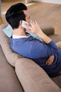 Man calling on the couch Royalty Free Stock Photo