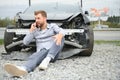 Man calling help after a car crash accident on the road Royalty Free Stock Photo