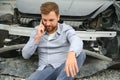 Man calling help after a car crash accident on the road Royalty Free Stock Photo