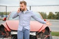 Man calling help after a car crash accident on the road Royalty Free Stock Photo