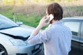 Man calling help after car crash accident on the road Royalty Free Stock Photo