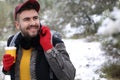 Man calling by phone from the snow