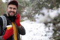 Man calling by phone from the snow