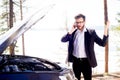 Man calling roadside assistance Royalty Free Stock Photo