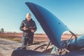 Man calling roadside service, assistance with his car broken down, car problem, transport concept