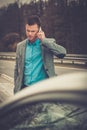 Man calling while tow truck picking up his car Royalty Free Stock Photo