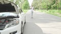 Man calling tow truck service on countryside road after his car broke down Royalty Free Stock Photo