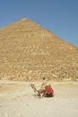 Man on camel near pyramids Royalty Free Stock Photo