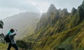 Man with camera taking a foto of gorgeous canyon valley on the path from Xo-Xo Valley. Santo Antao Island, Cape Verde