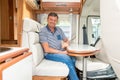 Man in campervan motor van home vanlife vacation in camper RV car Royalty Free Stock Photo