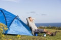 Man camping outdoors and cooking Royalty Free Stock Photo