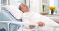 Man, cancer and patient in hospital bed thinking about healthcare, wellness and healing in clinic after surgery. Medical Royalty Free Stock Photo