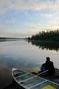 Man, Canoe and sunrise Royalty Free Stock Photo