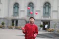 A man in a cap juggles with pink balls