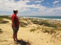 Man at Cape Recife nature reserve at Angola bay in Port Elizabeth on Sunshine Coast, South Africa Royalty Free Stock Photo