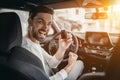 Man in car dealership Royalty Free Stock Photo