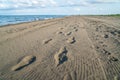 Man and car footprint on sand, Poti, Georgia Royalty Free Stock Photo