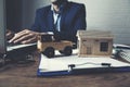 Man with car and house document