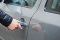 Man with car key. Opening car door. Royalty Free Stock Photo