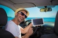 Man in car showing blank screen digital tablet device. Travel an Royalty Free Stock Photo