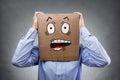 Man with cardboard box on his head showing shocked and surprised expression Royalty Free Stock Photo