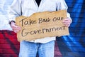 Man with cardboard sign, Take Back Our Government, with American Flag, Royalty Free Stock Photo