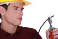 Man carefully cutting wire Royalty Free Stock Photo