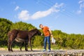 Man caressing and feed a wild donkeys Royalty Free Stock Photo