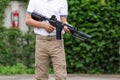 Man in cargo pants with gun Royalty Free Stock Photo