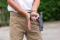 Man in cargo pants with gun Royalty Free Stock Photo