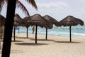 Man on Caribbean beach with umbrellas, Playa del Carmen, Mexico Royalty Free Stock Photo