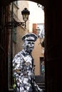 Man in carnival costume, walking in sanremo alley