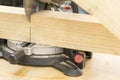 man carpenter cutting wood using table saw at construction site Royalty Free Stock Photo