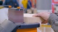 Man carpenter using belt sander machine, polishing wood product: close up Royalty Free Stock Photo