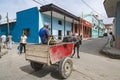 Santiago de Cuba, horse-drawn cart in front of colorful houses