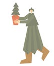 Man carries Christmas Tree in pot