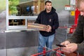 Man carries Costco pizza