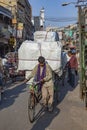 man carries huge cargo with his bicycle in old Delhi, Chawri Bazaar