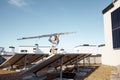 Man carries ladder during solar panels installation Royalty Free Stock Photo