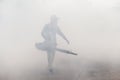 Man carries out fogging at village for anti-mosquito