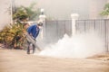 Man carries out fogging at village for anti-mosquito
