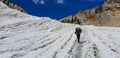 Man carry bag walk on glacier to chommala pass on the way to everest base camp in Nepal Royalty Free Stock Photo